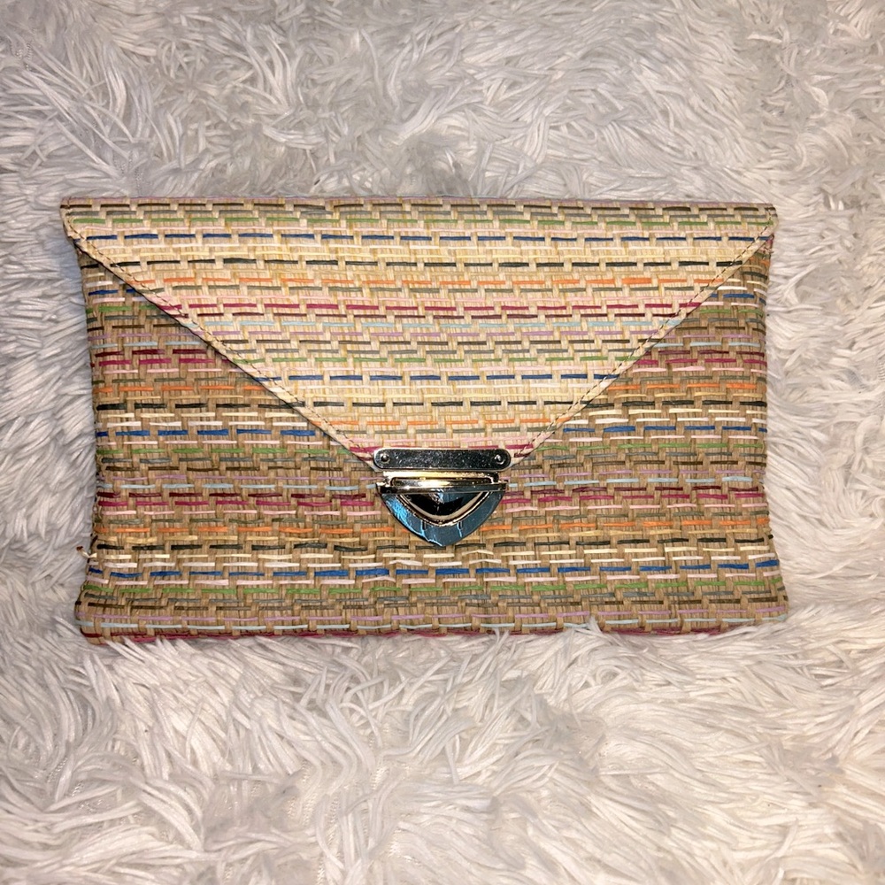 Khaki colored straw material clutch with gold buckle on the front. NEVER WORN